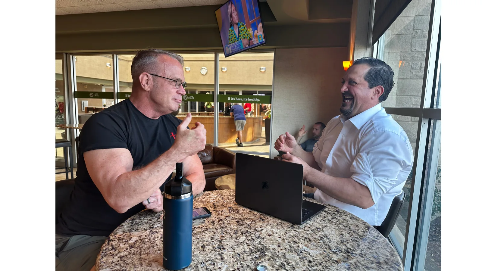Tony Kurtulan in a sales conversation at a table